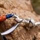 10751261-carbine-and-hook-with-rope-in-stone
