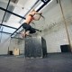 29385698-low-angle-view-of-young-female-athlete-box-jumping-at-a-crossfit-gym-fit-woman-is-performing-box-jum
